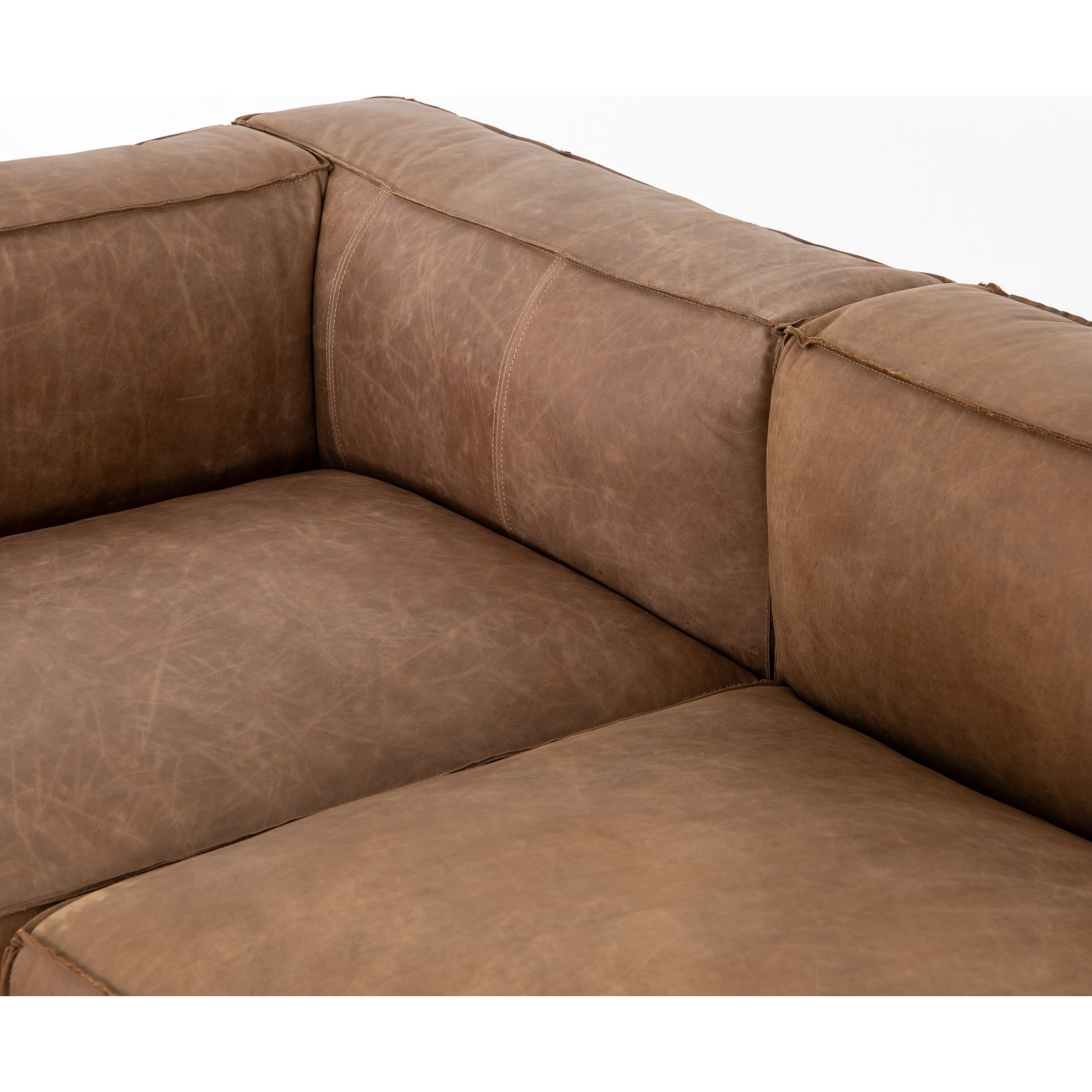 Nolita Sectional Sofa by Four Hands in natural washed. Made from top grain leather, solid ash, 100% polyester in a modern style.