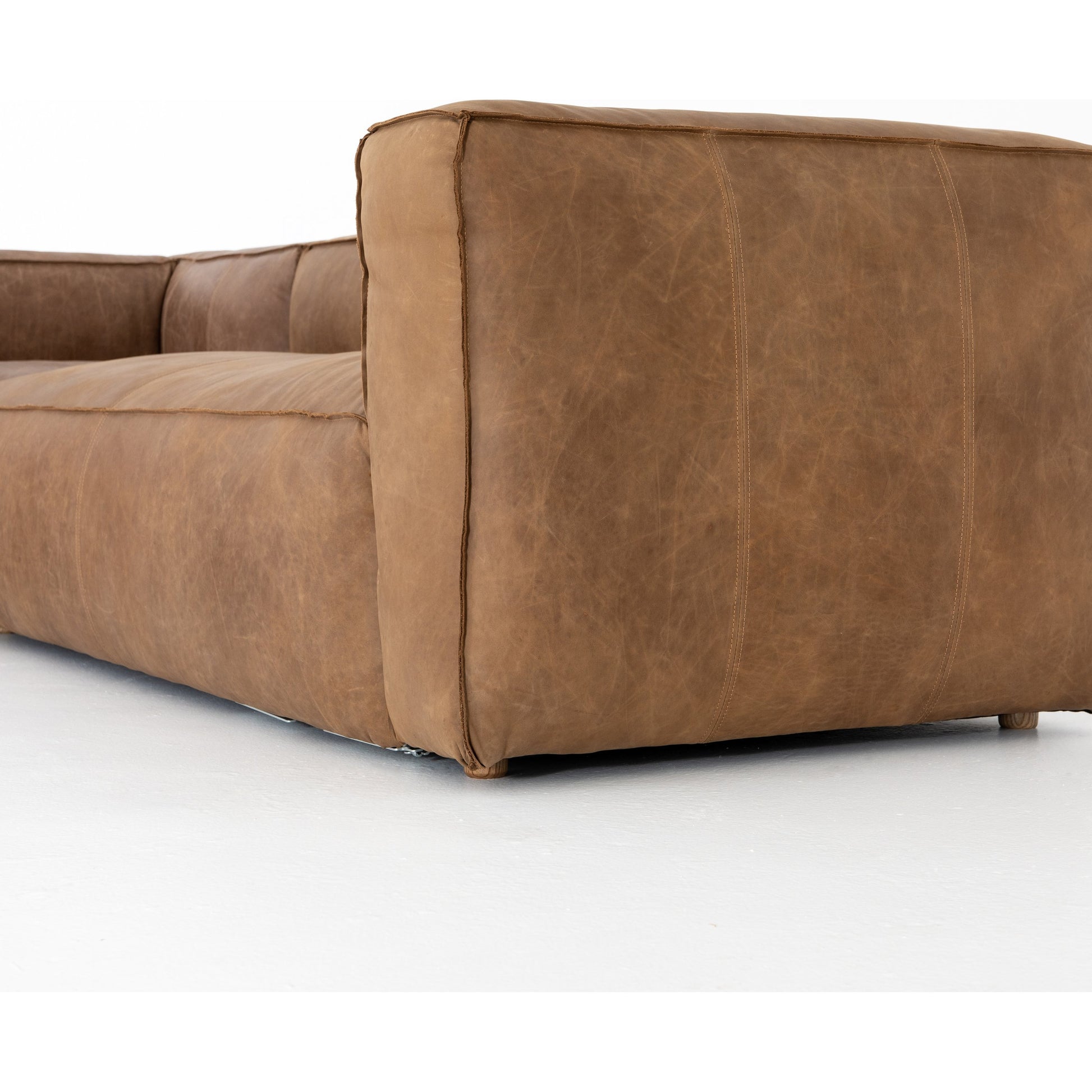 Nolita Sectional Sofa by Four Hands in natural washed. Made from top grain leather, solid ash, 100% polyester in a modern style.