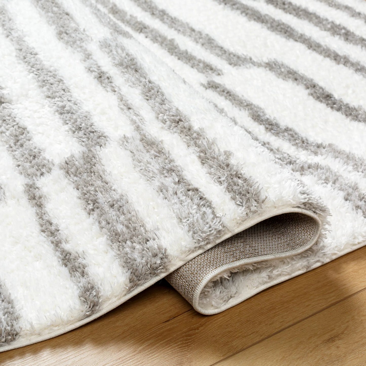 004 SI-2052507,SI-2052508,SI-2052509 | Closeup | Cloudy Shag Rug - 490566 by Livabliss in off-white, gray, charcoal. Made from face: 100% polyester, warp: 60% jute, 40% polyester in a unique style.