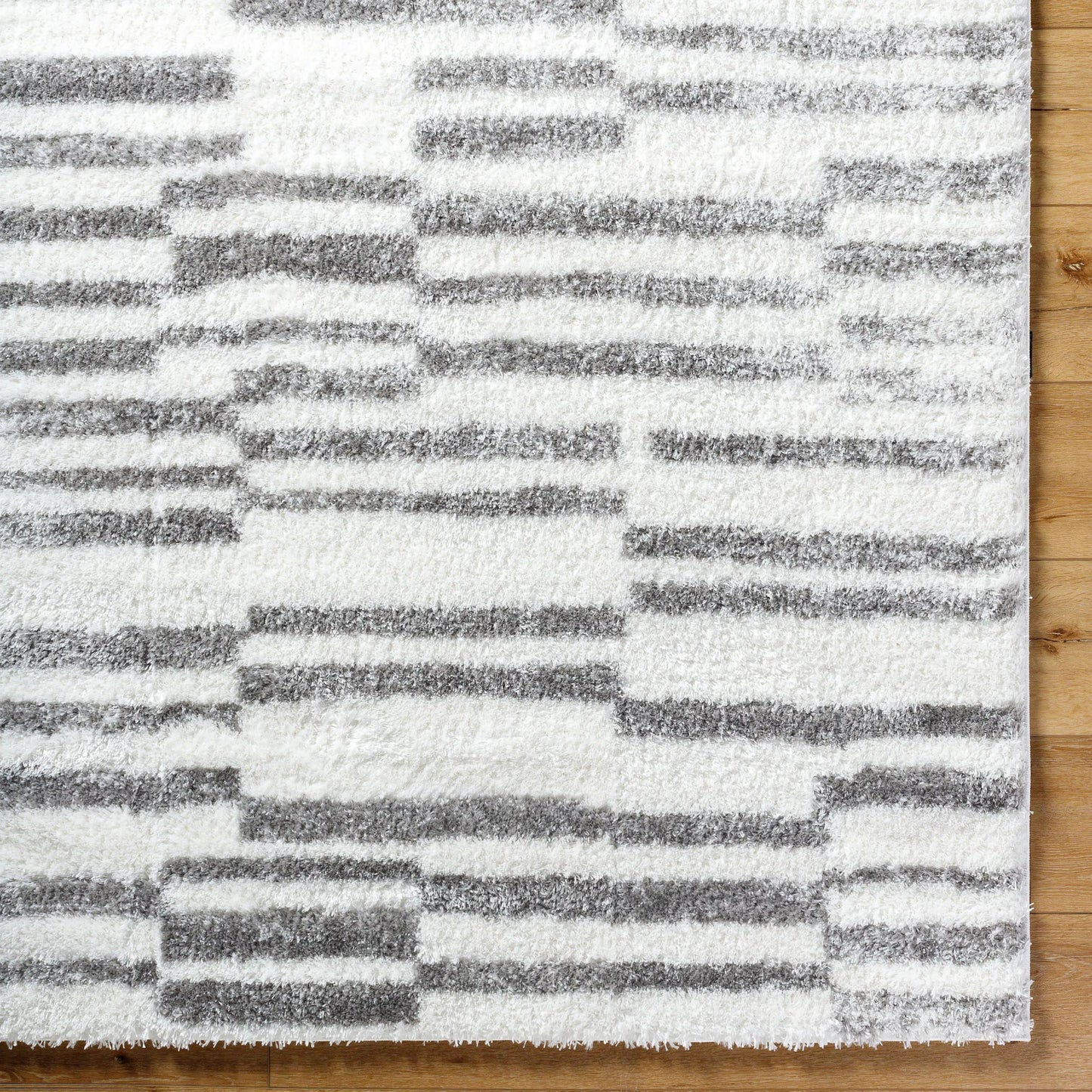 006 SI-2052507,SI-2052508,SI-2052509 | Closeup | Cloudy Shag Rug - 490566 by Livabliss in off-white, gray, charcoal. Made from face: 100% polyester, warp: 60% jute, 40% polyester in a unique style.
