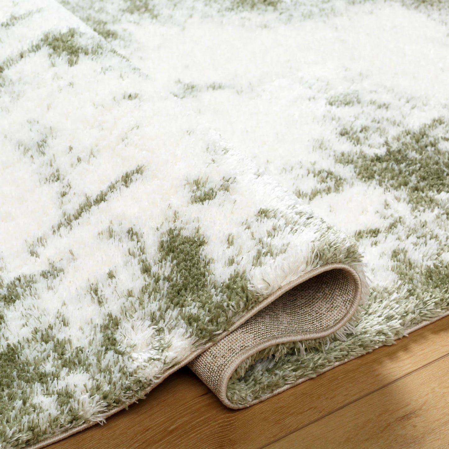004 SI-2052510,SI-2052511,SI-2052512 | Closeup | Cloudy Shag Rug - 490572 by Livabliss in off-white, grass green. Made from face: 100% polyester, warp: 60% jute, 40% polyester in a unique style.