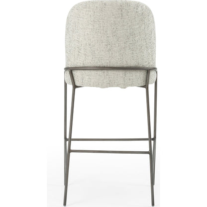 Astrud Bar Stool by Four Hands in sierra butterscotch. Made from faux leather, iron, top grain leather in a modern style.