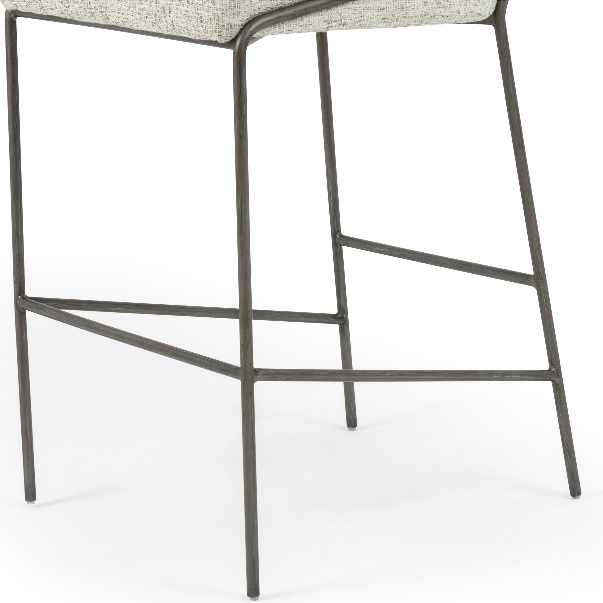 Astrud Bar Stool by Four Hands in sierra butterscotch. Made from faux leather, iron, top grain leather in a modern style.