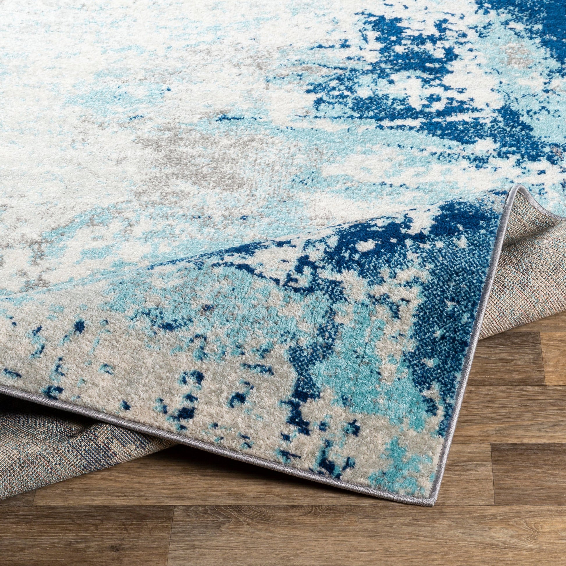 Chester Rug by Livabliss in dark blue, aqua. Made from 100% polypropylene in a modern style.