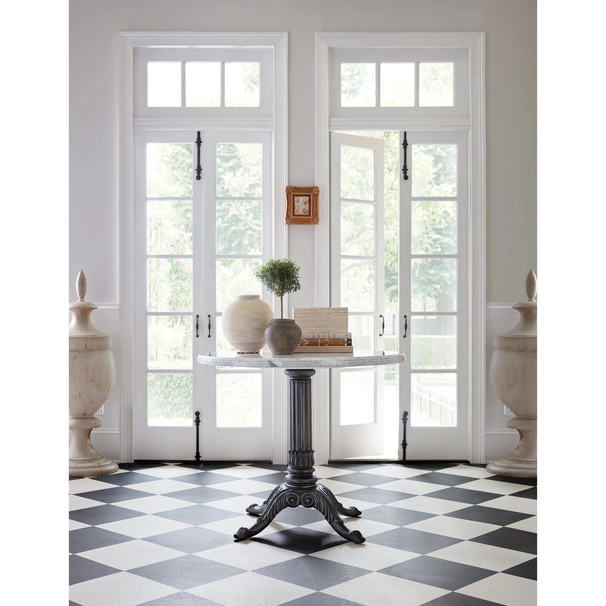 Charleston Bistro Table by Hooker Furniture in garden gate black. Made from resin with veneered carrara stone in a modern style.