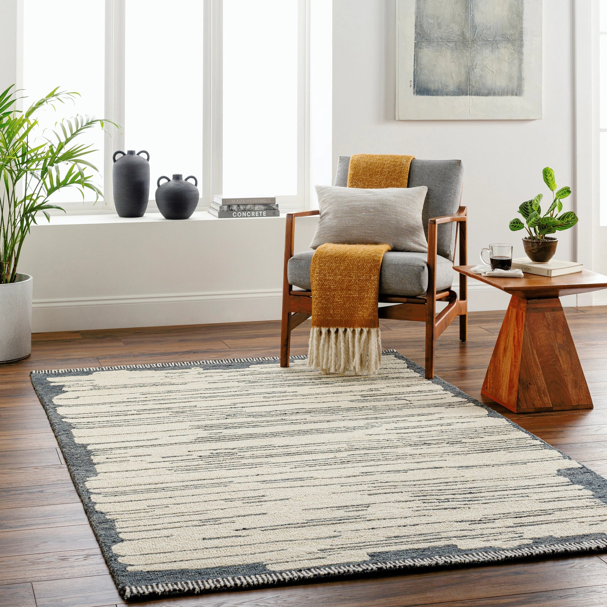 Cherokee Rug - 30181 by Livabliss in oatmeal, charcoal, black, cream. Made from 100% wool in a unique style.
