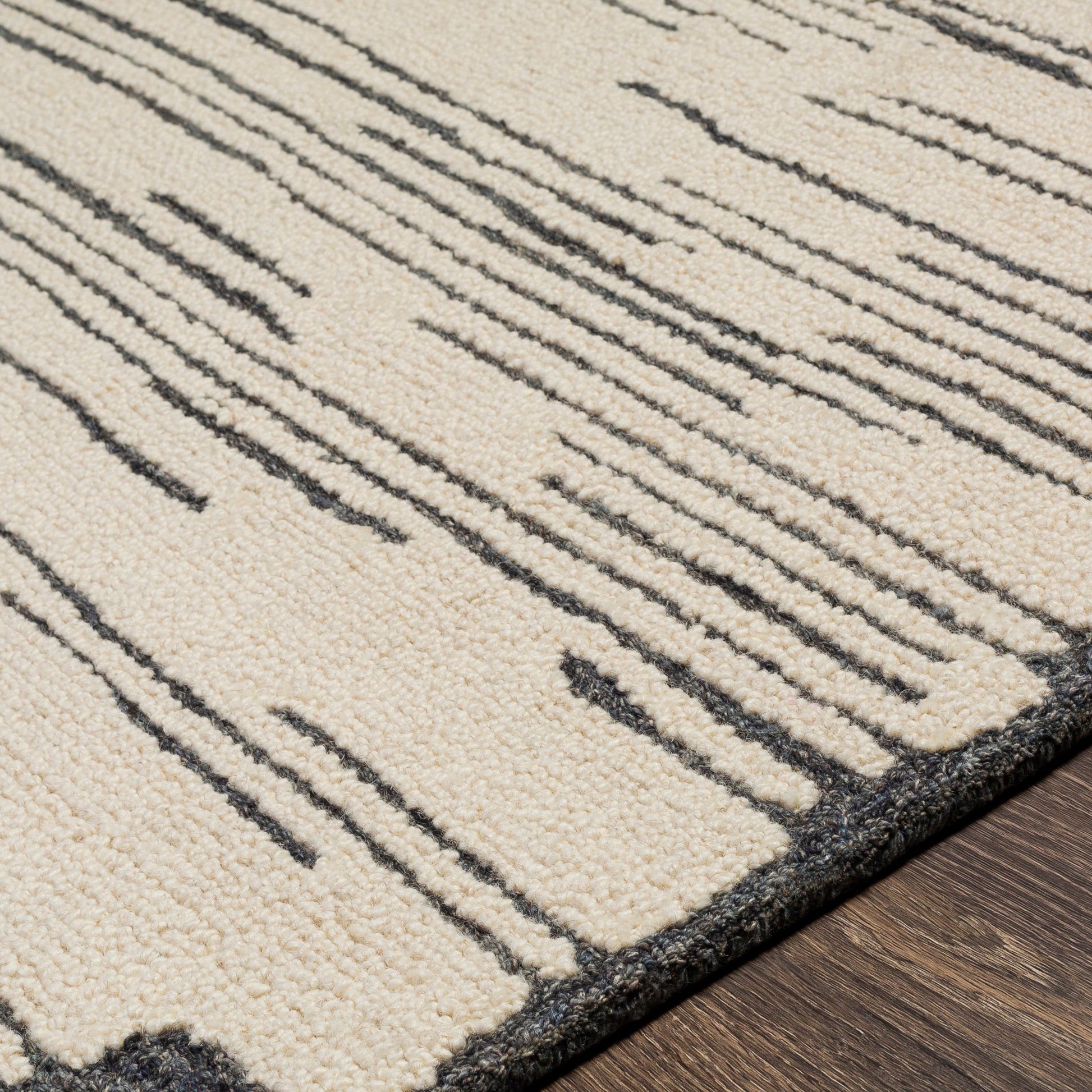 Cherokee Rug - 30181 by Livabliss in oatmeal, charcoal, black, cream. Made from 100% wool in a unique style.
