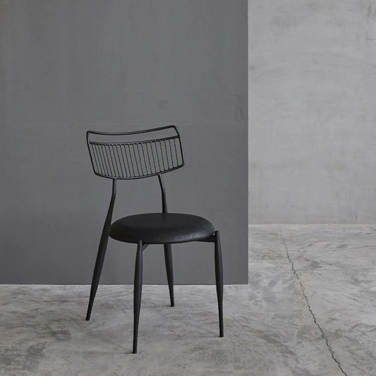Madeleine Curved Back Chair by Zentique in matte black steel, dark grey pu. Made from steel, pu leather in a modern style.