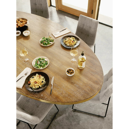 Evans Oval Dining Table by Four Hands in reclaimed burnt oak, vessel grey, polished brass. Made from solid reclaimed oak, iron, stainless steel in a modern style.