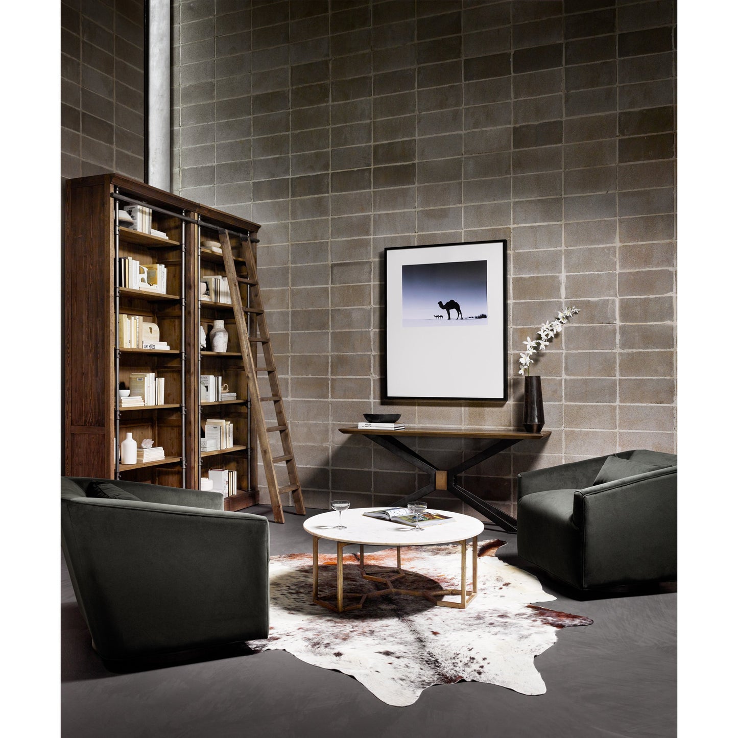 003 S-338946 | Lifestyle | Spider Console Table by Four Hands in light rustic black, bright brass clad, sandy oak. Made from brass, iron, solid oak in a modern style.