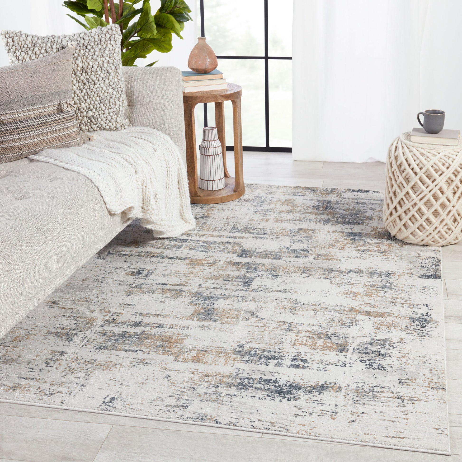 Gesine Rug by Jaipur Living in light gray, gold. Made from 65% shrink polyester, 35% viscose in a unique style.