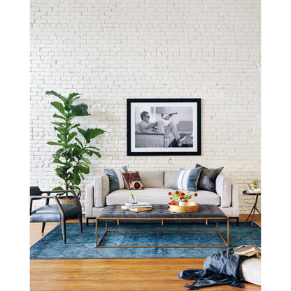 Oxford Coffee Table by Four Hands in rialto ebony and antique brass. Made from top grain leather, iron, 100% polyester in a modern style.