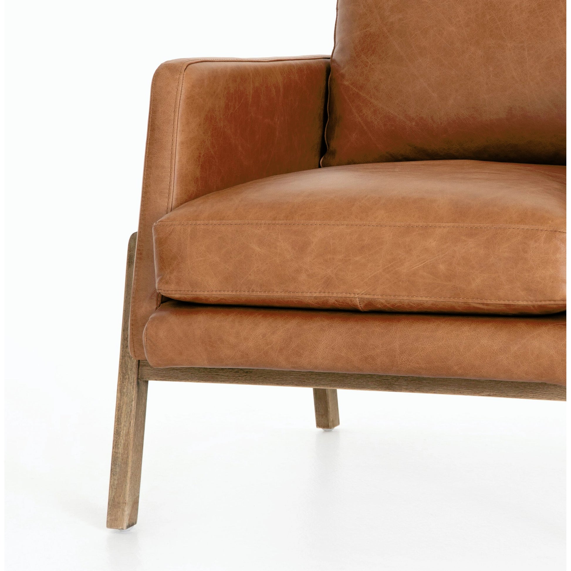 Diana Chair by Four Hands in sonoma butterscotch. Made from top grain leather, solid parawood, 100% polyester in a modern style.