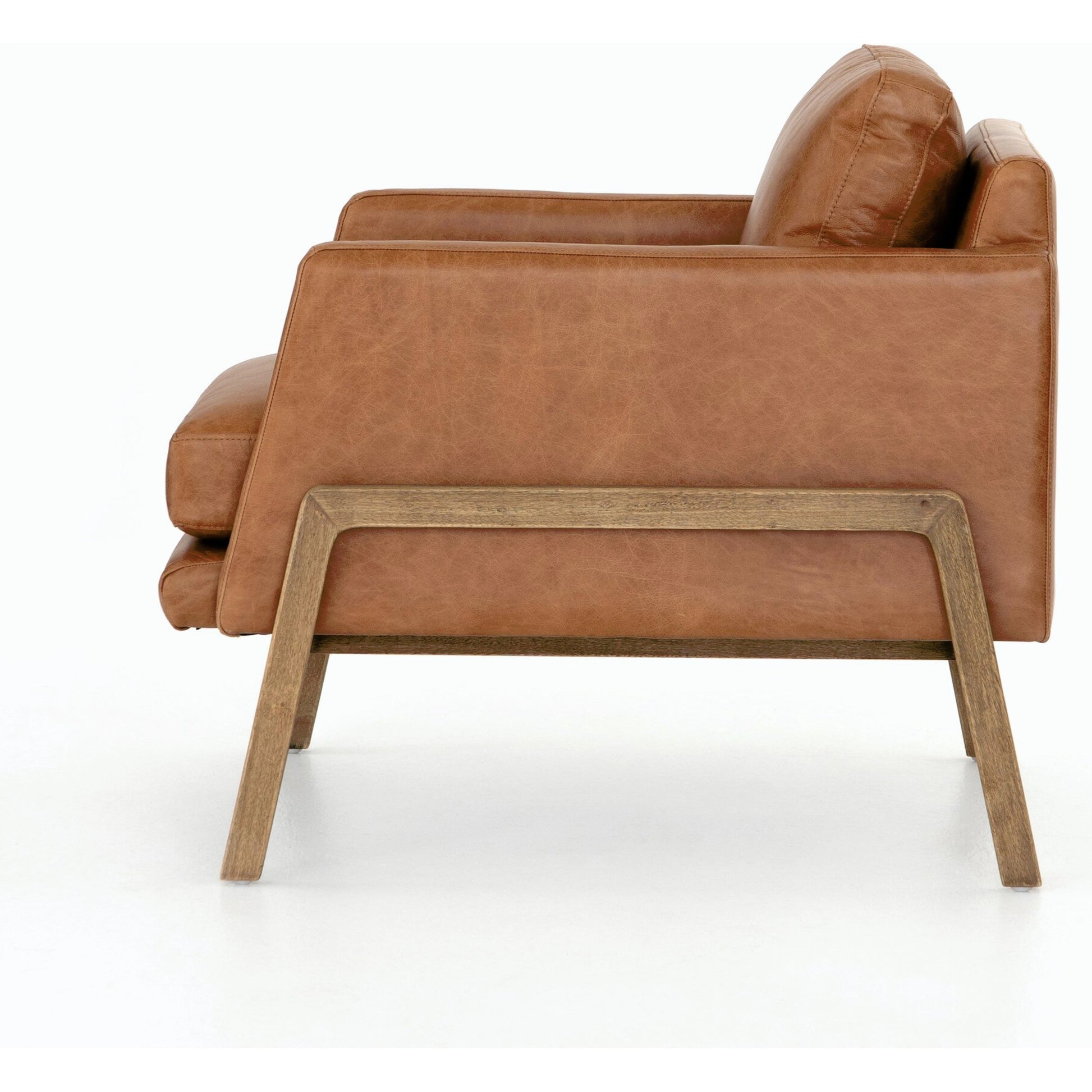 Diana Chair by Four Hands in sonoma butterscotch. Made from top grain leather, solid parawood, 100% polyester in a modern style.