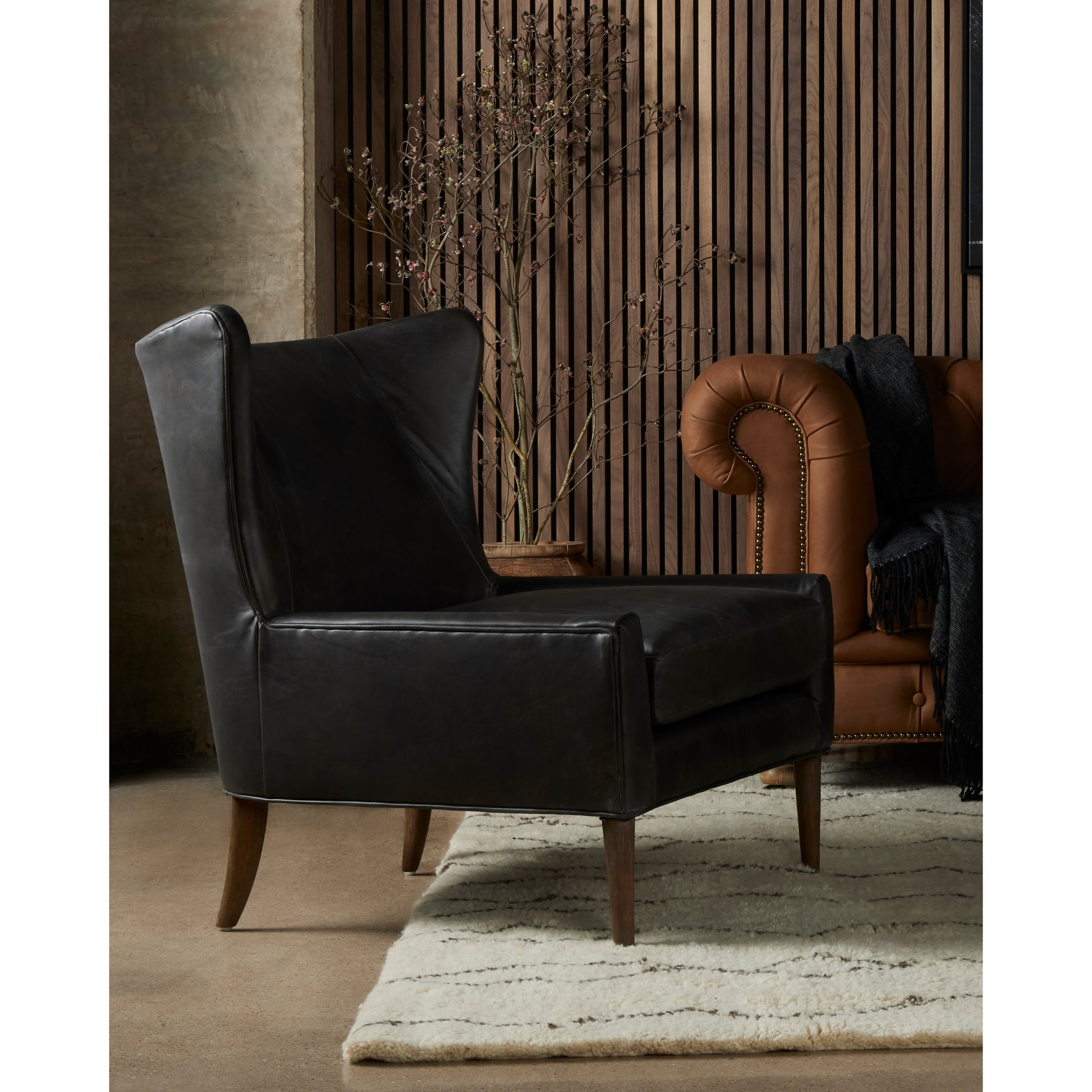 Marlow Wing Chair by Four Hands. Made from top grain leather, solid parawood, 100% polyester in a modern style.