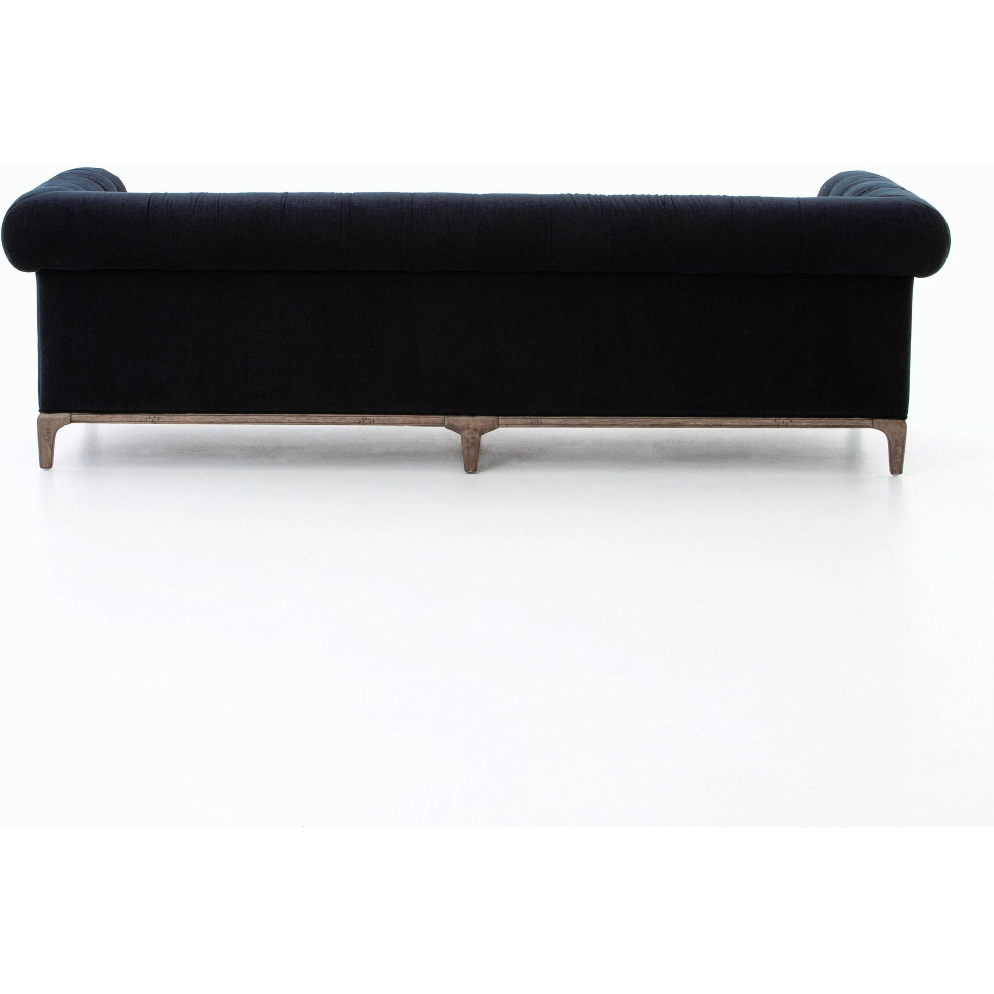 Griffon Sofa by Four Hands in plush navy and plush navy, antique walnut. Made from 100% polyester, solid parawood in a modern style.