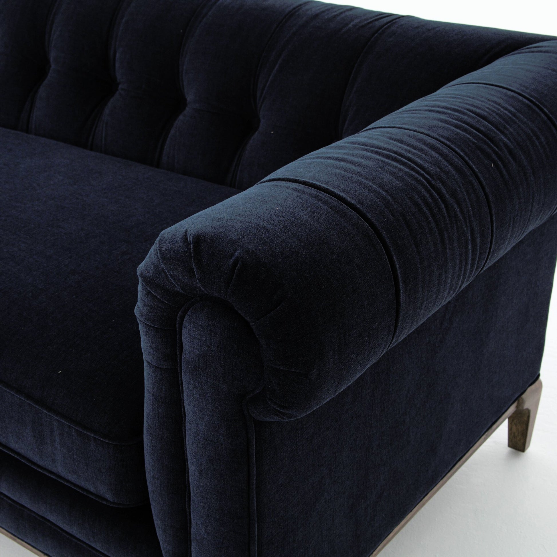 Griffon Sofa by Four Hands in plush navy and plush navy, antique walnut. Made from 100% polyester, solid parawood in a modern style.