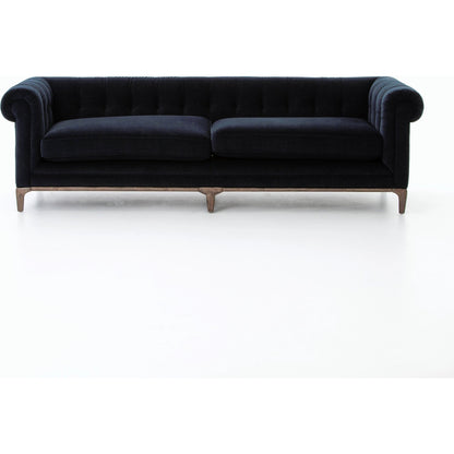 Griffon Sofa by Four Hands in plush navy and plush navy, antique walnut. Made from 100% polyester, solid parawood in a modern style.