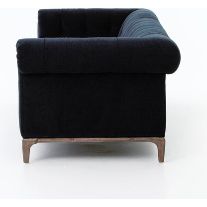 Griffon Sofa by Four Hands in plush navy and plush navy, antique walnut. Made from 100% polyester, solid parawood in a modern style.