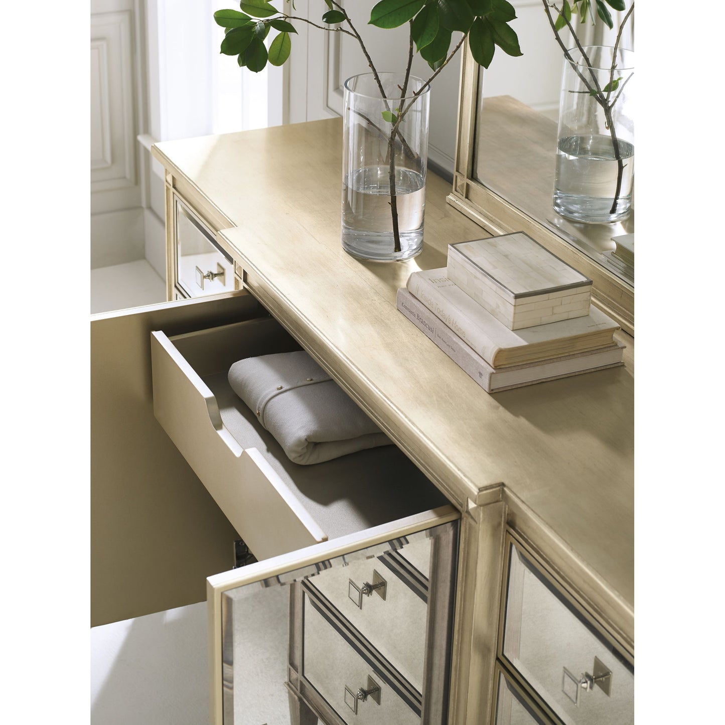 001 SR-768848 | Lifestyle | La-Dee-Dah-Dresser by Caracole in mirrored, silver and auric, gold bullion paint. Made from birch, maple, pine in a traditional style.