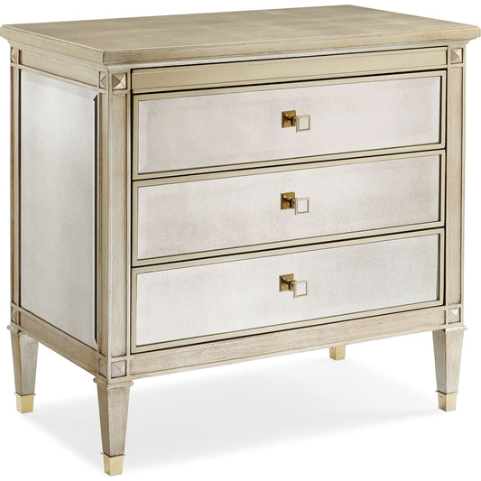 A Classic Beauty Chest by Caracole in silver and auric, gold bullion paint. Made from birch, maple, pine in a traditional style.