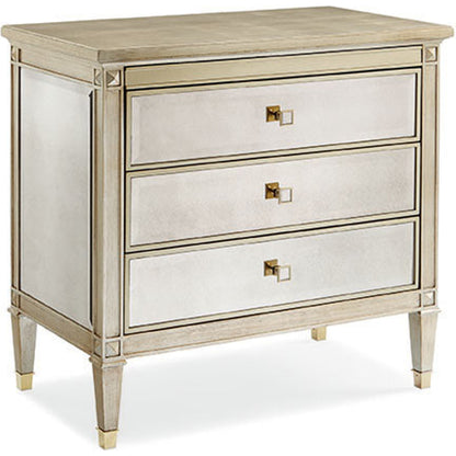 A Classic Beauty Chest by Caracole in silver and auric, gold bullion paint. Made from birch, maple, pine in a traditional style.