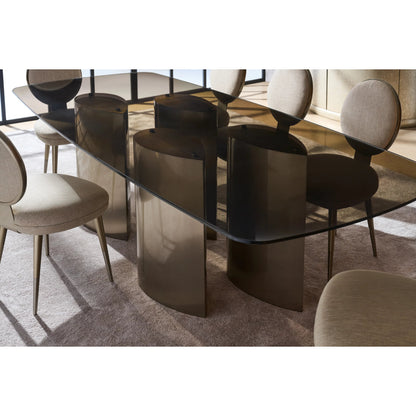 Aphelion Dining Table by Caracole in brushed whisper of gold. Made from metal, glass in a modern style.