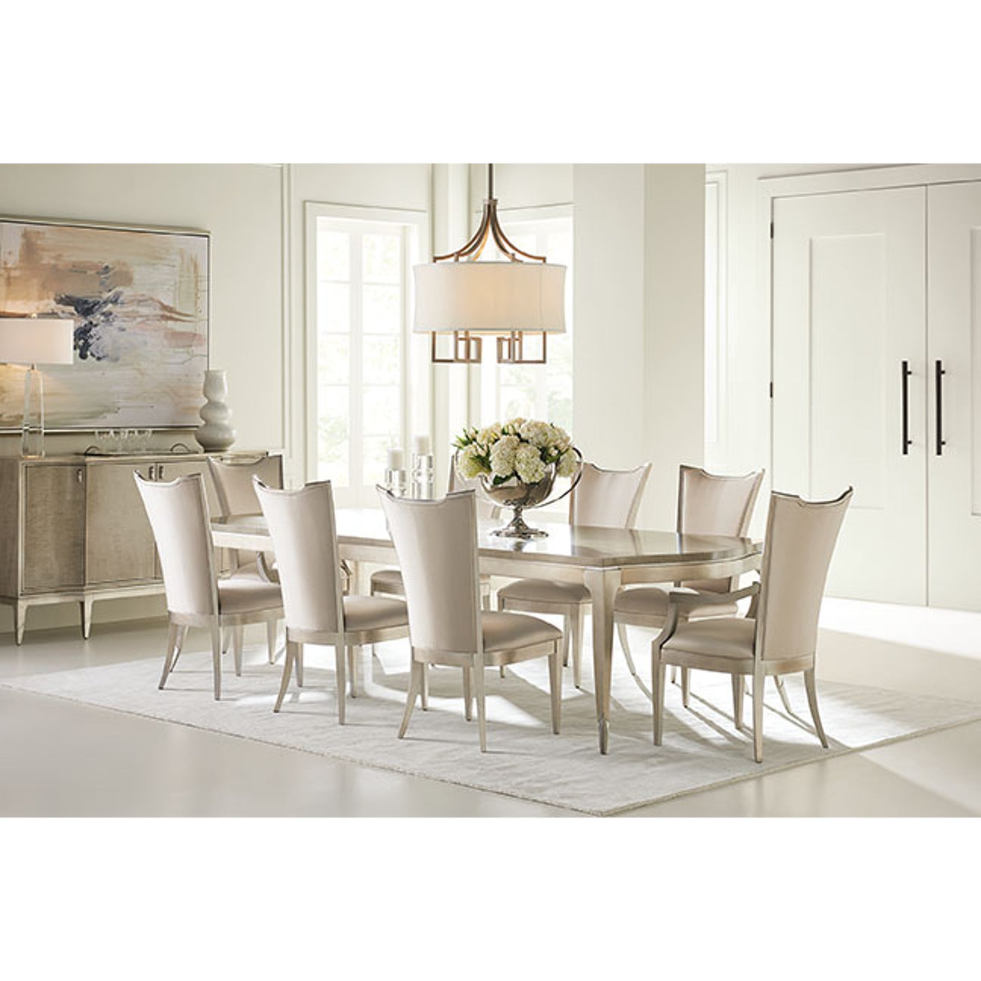 On a Silver Platter Dining Table by Caracole in maple, silver and moonlit sand, soft silver leaf. Made from pine, birch, silver curly maple in a transitional style.