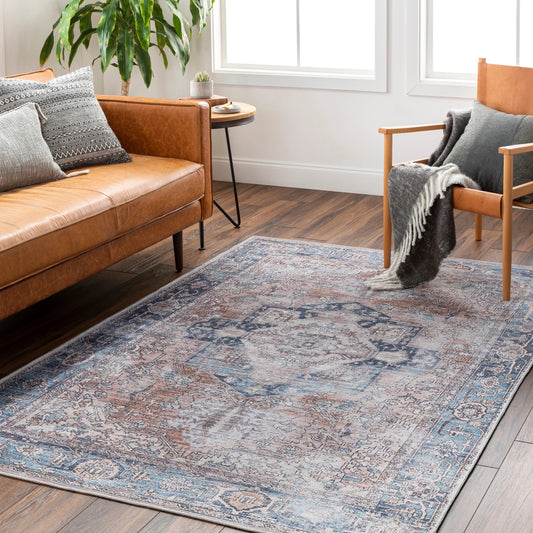 Colin Rug by Livabliss in medium brown, ink blue, tan, medium gray, white, light gray. Made from main: 66% chenille-polyester, main: 34% cotton in a modern style.