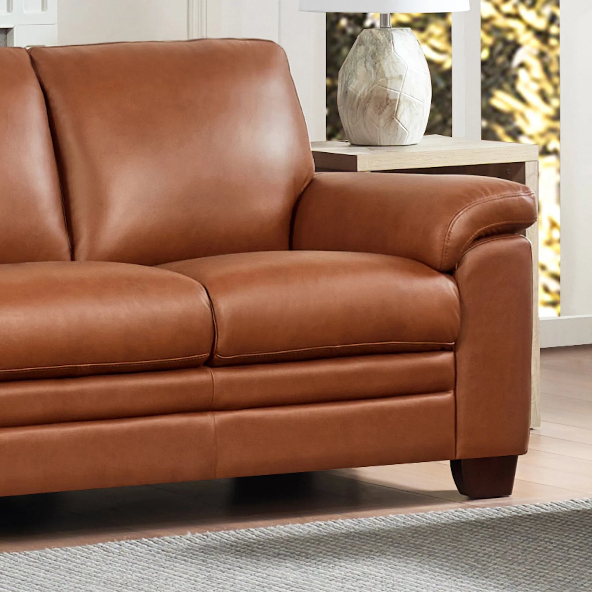 Magnum Sofa by Hydeline in chestnut brown. Made from leather in a traditional style.