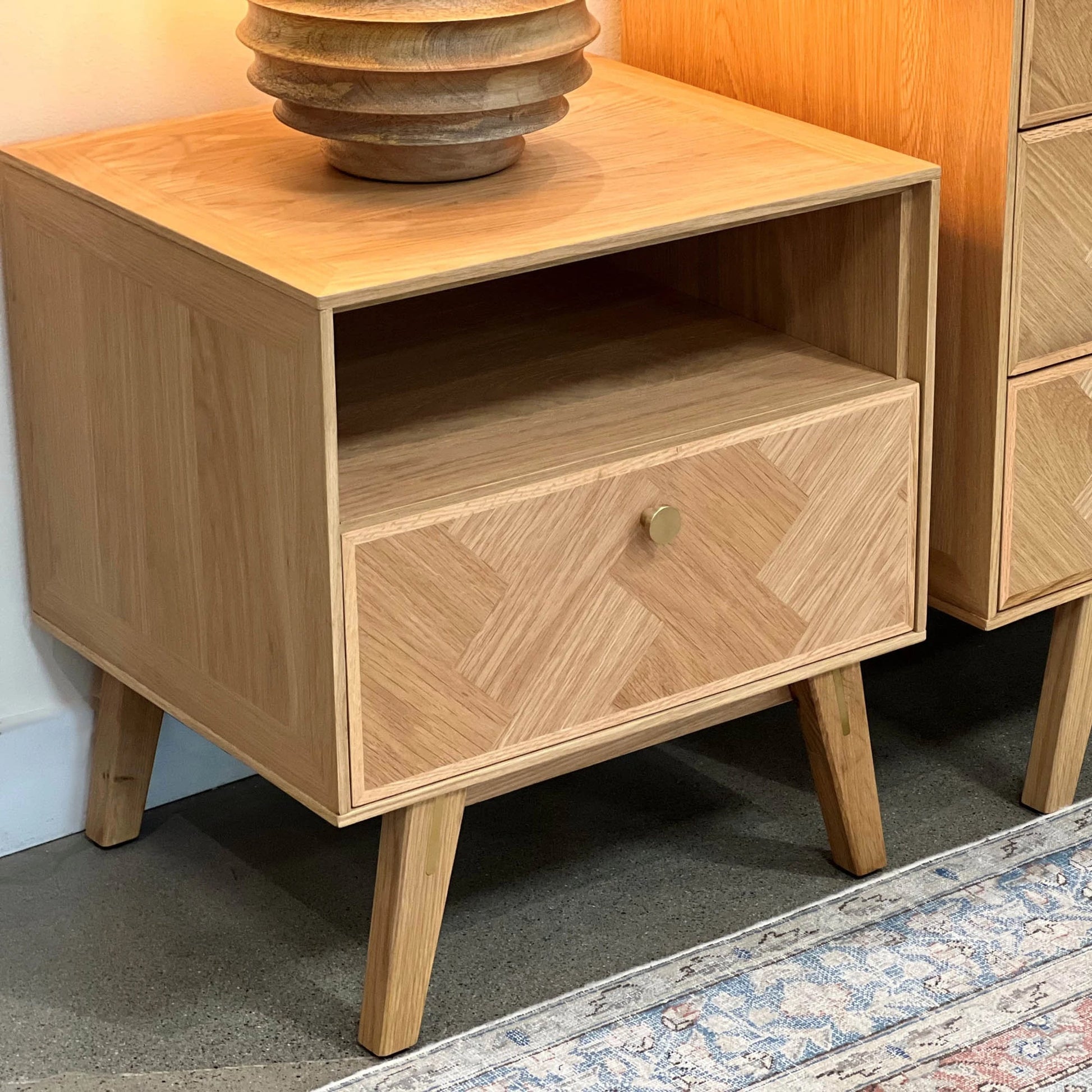 Colton Nightstand by LH Imports in light brown and natural, brass. Made from solid oak, mdf oak veneer, brass in a transitional style.