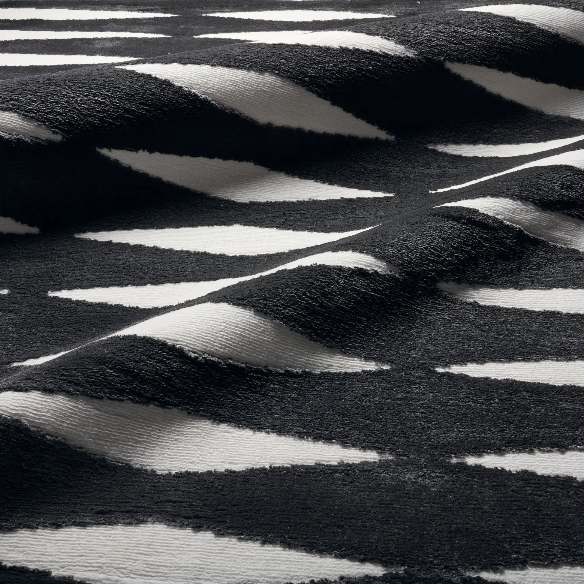 Calix by Nikki Chu CNU01 Rug by Jaipur Living in black, white. Made from 70% polypropylene 30% polyester in a unique style.