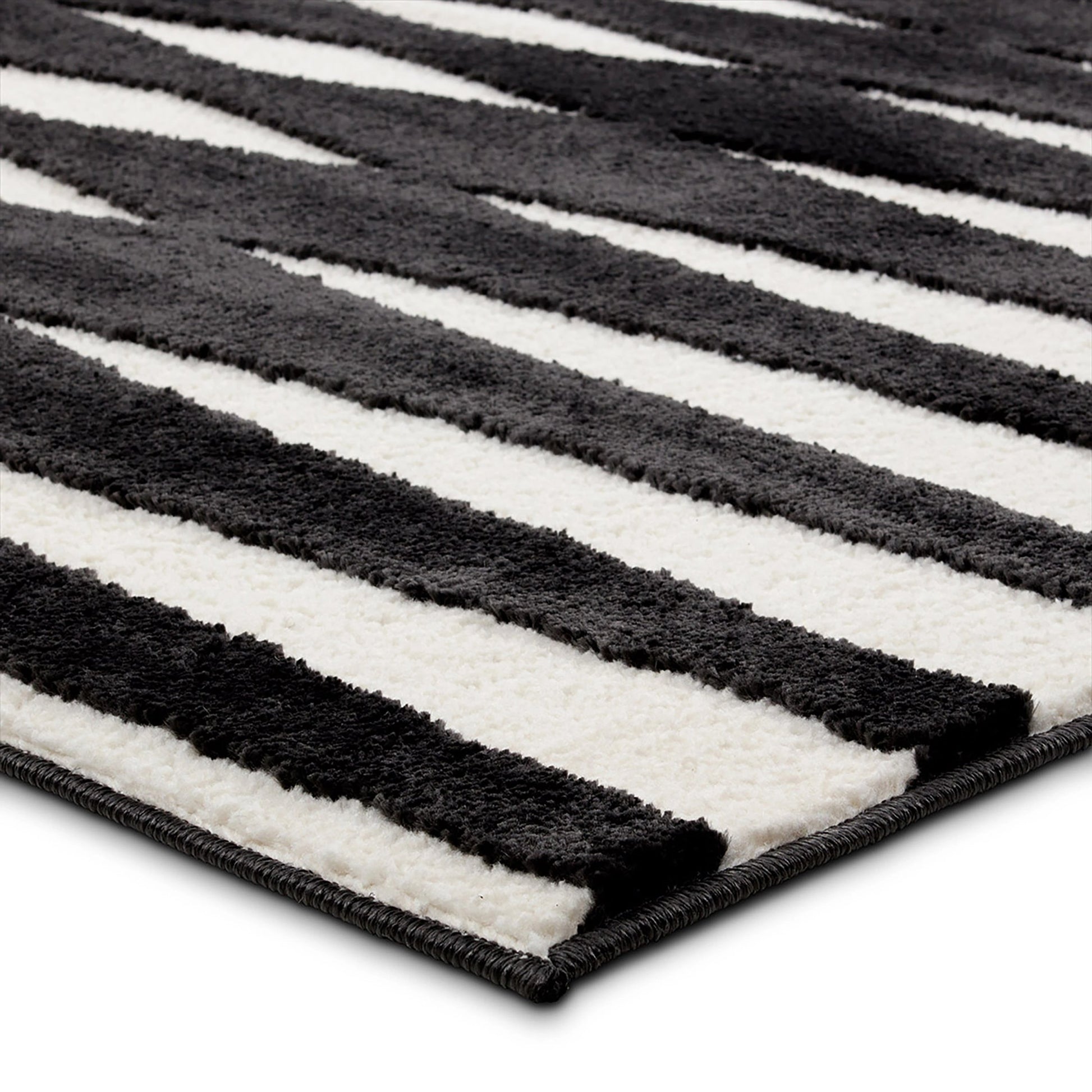 Calix By Nikki Chu Apyre CNU01 Rug by Jaipur Living in black, white. Made from 70% polypropylene 30% polyester in a unique style.