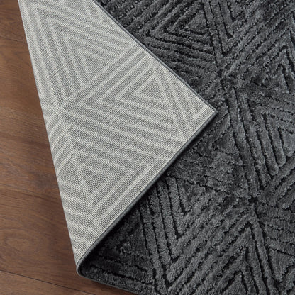 Calix by Nikki Chu CNU04 Rug by Jaipur Living in black. Made from 70% polypropylene 30% polyester in a unique style.