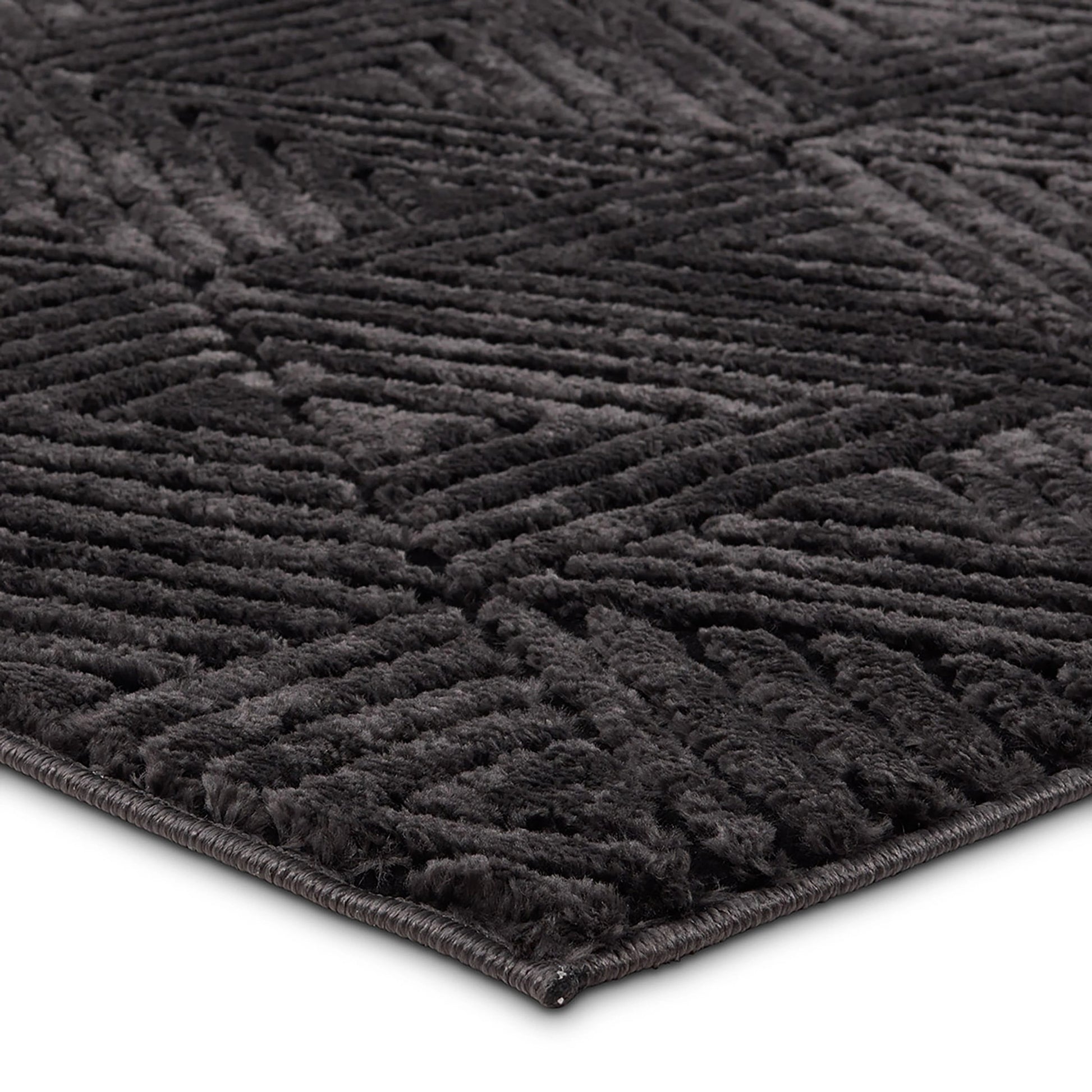 Calix by Nikki Chu CNU04 Rug by Jaipur Living in black. Made from 70% polypropylene 30% polyester in a unique style.
