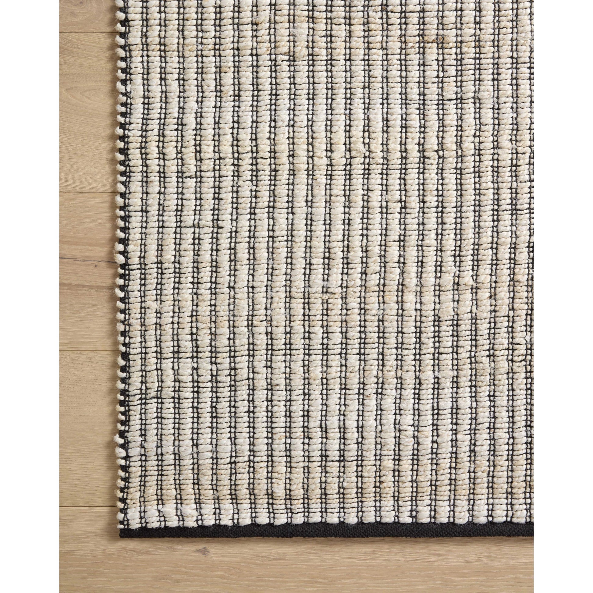 Colton CON-02 Rug by Angela Rose x Loloi in ivory, black. Made from jute / cotton in a unique style.