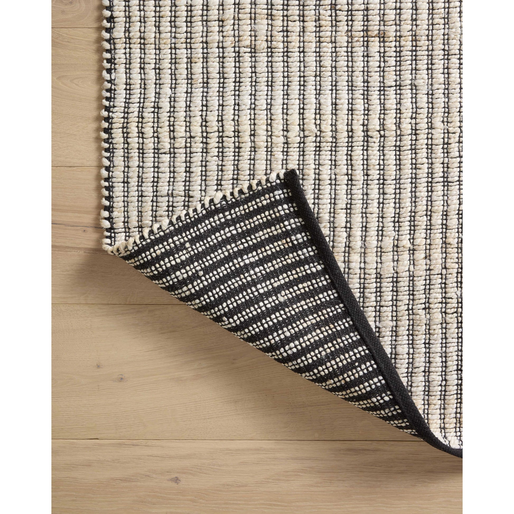 Colton CON-02 Rug by Angela Rose x Loloi in ivory, black. Made from jute / cotton in a unique style.