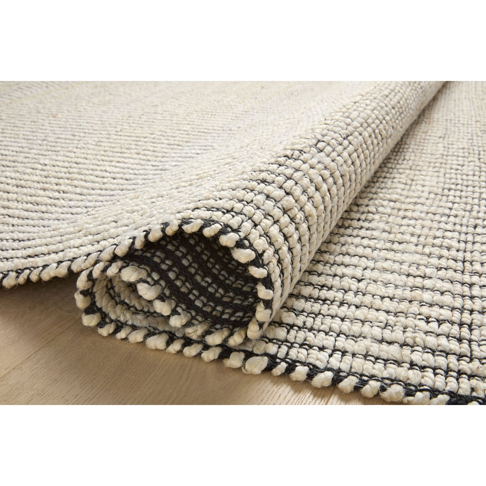 Colton CON-02 Rug by Angela Rose x Loloi in ivory, black. Made from jute / cotton in a unique style.