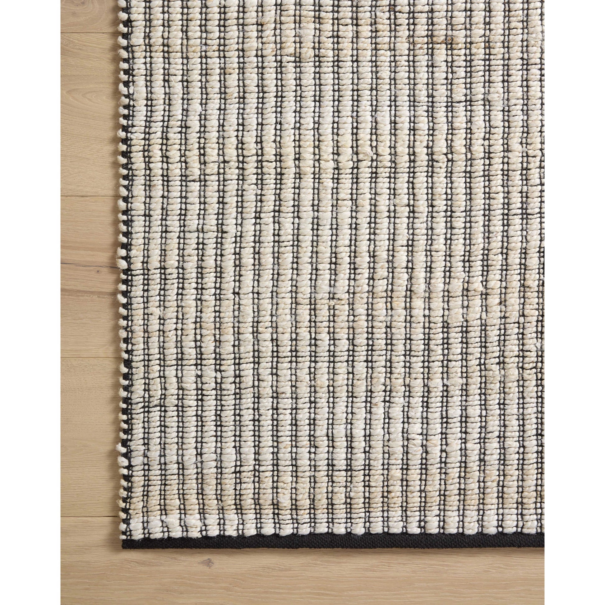 Colton CON-02 Rug by Angela Rose x Loloi in ivory, black. Made from jute / cotton in a unique style.