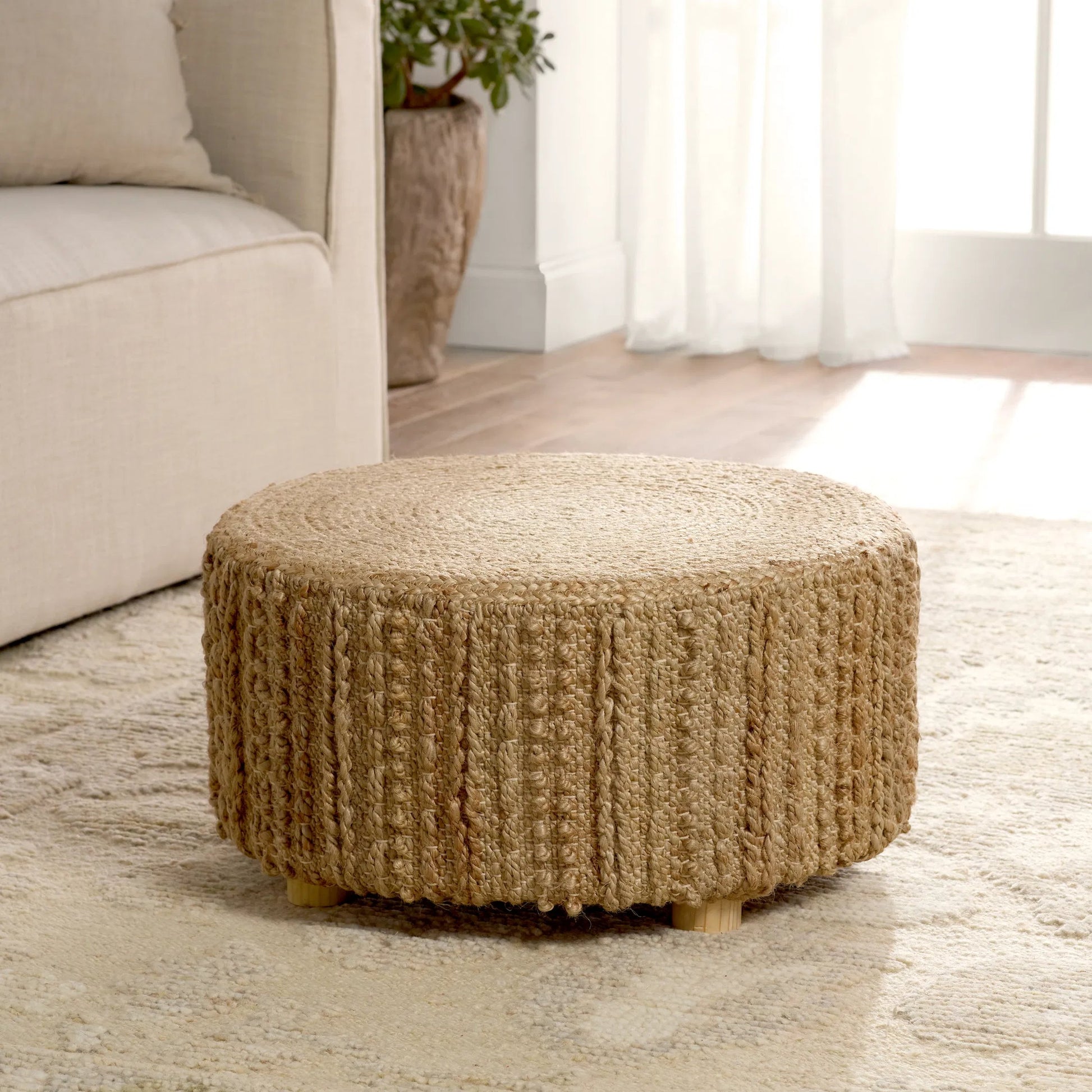 Core COO01 Pouf by Jaipur Living in brown. Made from 100% jute fiber in a cottage & farmhouse style.