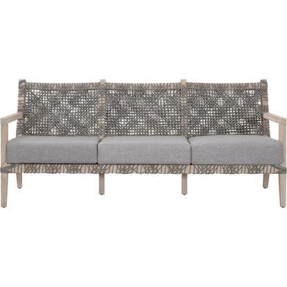 Costa Sofa by Essentials For Living in gray teak, performance dove. Made from solid teak wood, polyolefin rope, 100% olefin fabric, foam in a coastal style.