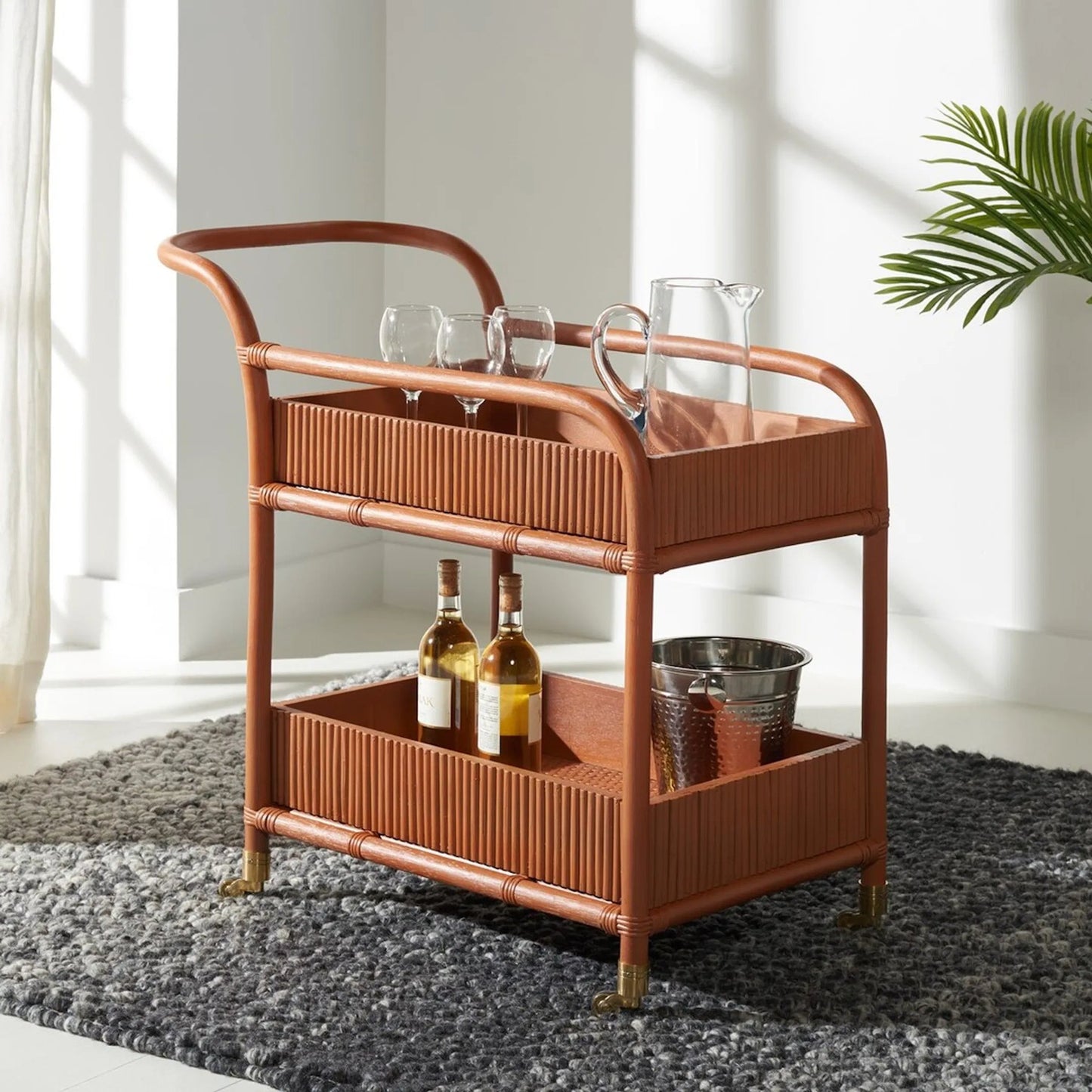 007 SI-2185965 | Lifestyle | Mulberry Rattan Pole Barcart by HedgeApple Essentials in amber. Made from rattan pole frame, rattan core, plywood brass in a cottage & farmhouse style.