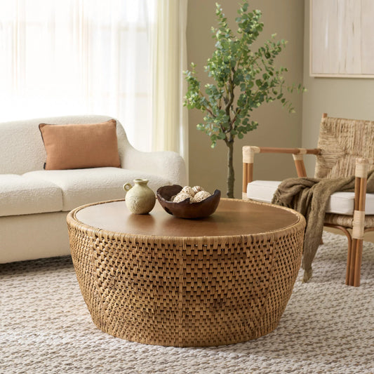 Craighead Rattan Round Coffee Table by HedgeApple Essentials in natural. Made from plywood, rattan in a rustic style.