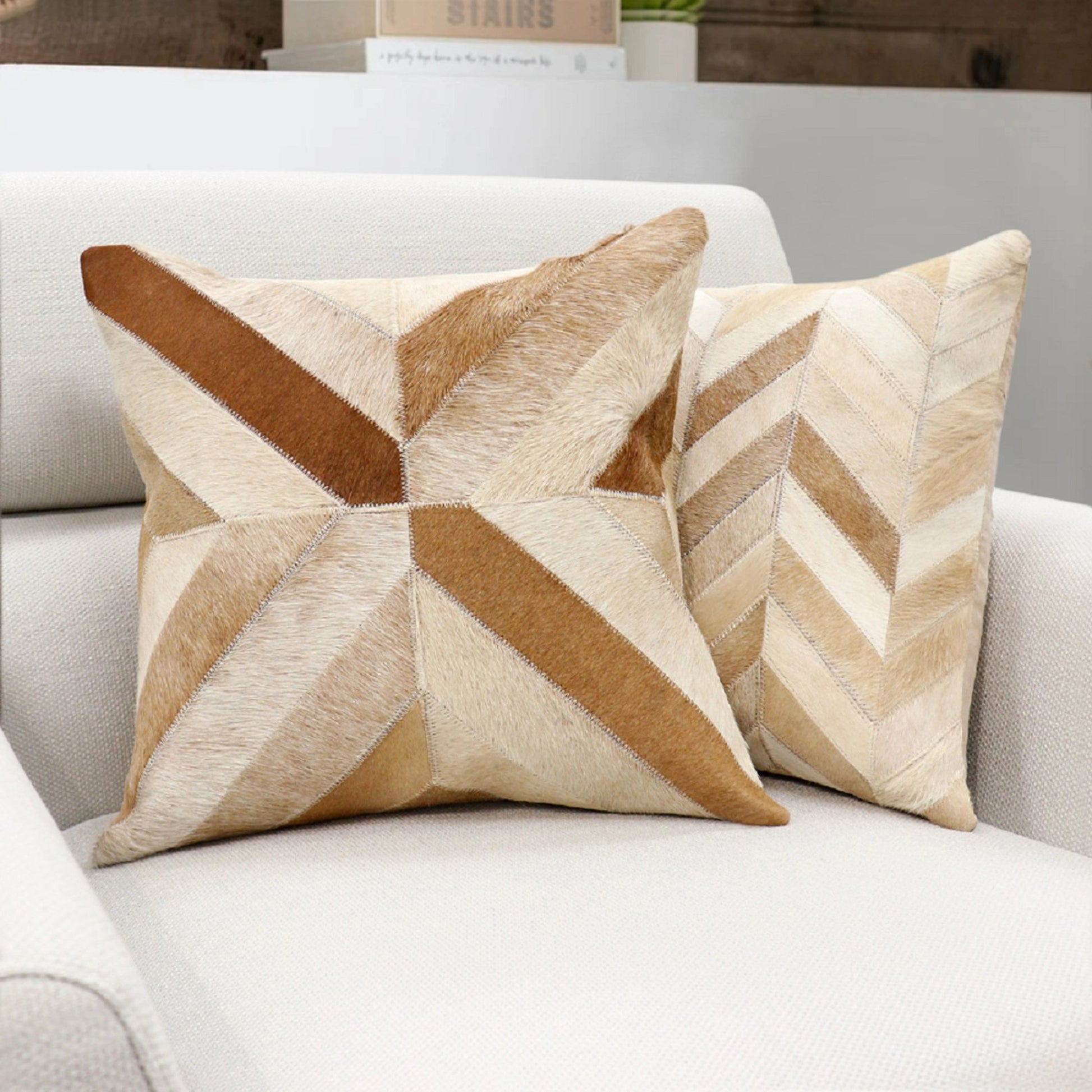 Safari Chevron Cowhide Throw Pillow by Pasargad Home in l. brown. Made from cowhide in a modern style.