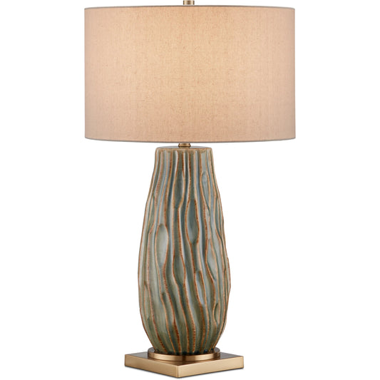 Water-Borne Table Lamp by Currey and Company in forest reactive, antique brass. Made from ceramic, metal in a modern style.