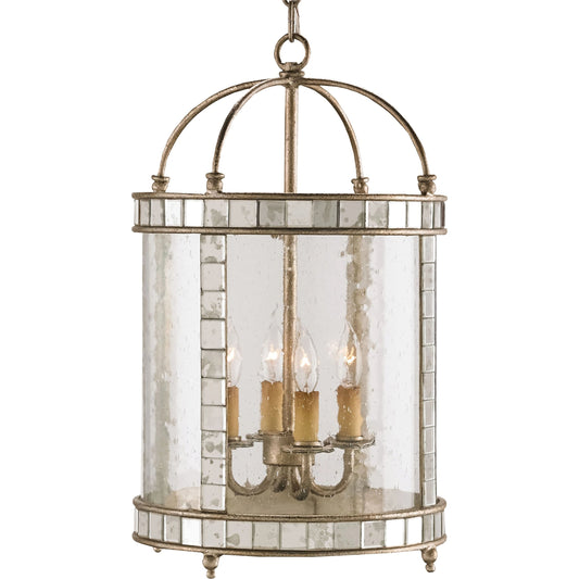 Corsica Lantern by Currey and Company in harlow silver leaf. Made from wrought iron, glass, mirror in a traditional style.