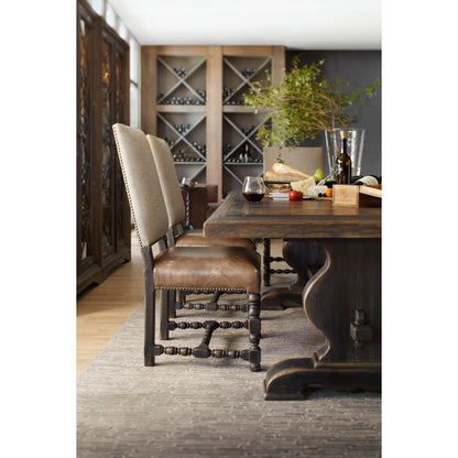 Bandera Dining Table by Hooker Furniture in saddle brown, anthracite black. Made from white oak, walnut veneers with resin in a traditional style.