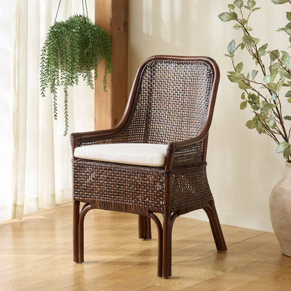 Ward Dining Chair with Cushion by HedgeApple Essentials. Made from rattan, 60% cotton, 40% polyester in a unique style.