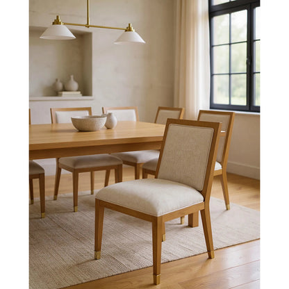 Santos Side Chair by Currey and Company. Made from mahogany, rattan, brass in a modern style.