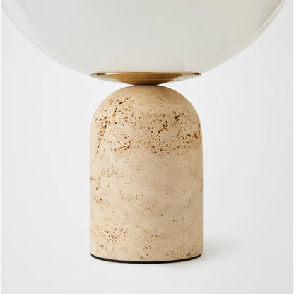 Orb Table Lamp by Global Views in travertine. Made from travertine, glass in a transitional style.